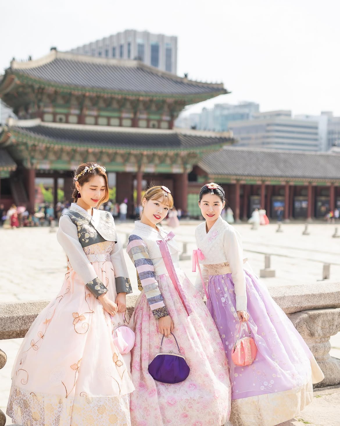 Guests in hanbok enjoying Gyeongbokgung Palace — rented from Seohwa Hanbok